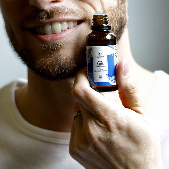 huile à barbe avec un homme